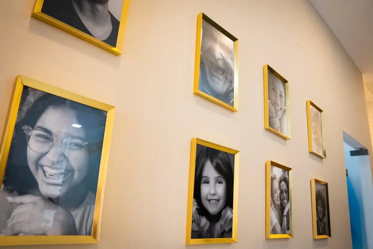 Framed smile portraits in the Al Warqa clinic