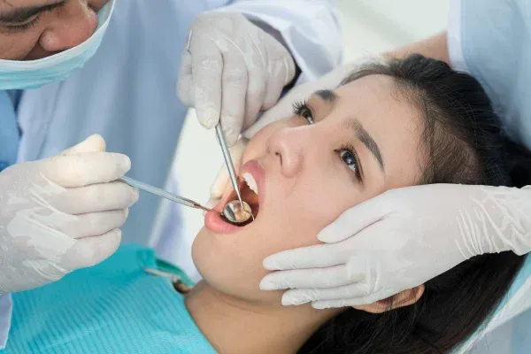 A dentist examining a patient’s teeth